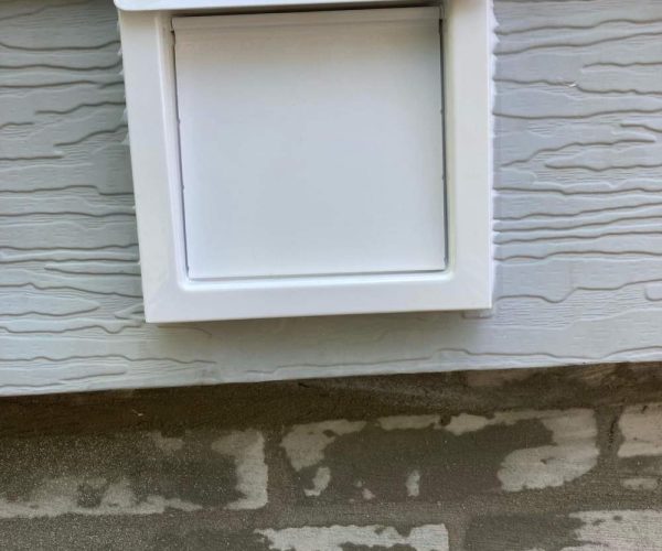 dryer vent on gray home