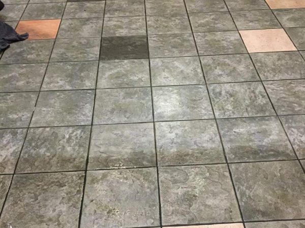 gray tile and grout before cleaning