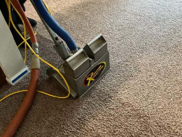 machine extracting water from carpet